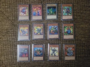 YUGIOH 12 TOON CARDS TOON MASKED SORCERER + TOON GEMINI ELF + TOON BUSTER + MORE - Picture 1 of 1