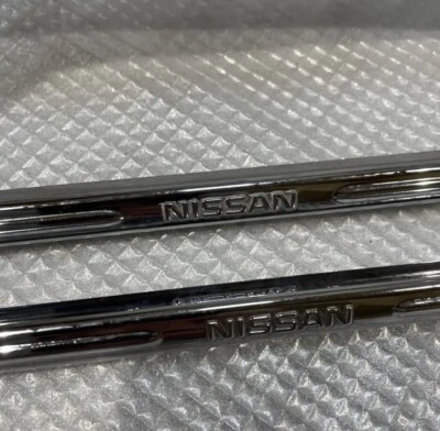 JDM NISSAN Genuine License Plate Frame Holder chrome Japan 2pcs - Image 1 of 4
