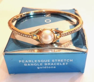 Pulsera elástica nacarada Avon acento diamantes de imitación tono dorado NUEVA en caja Foto 1 de 4