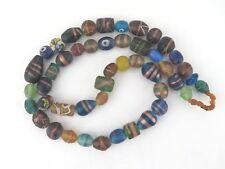 Trade beads. Glass bead strand from Nepal. Beads with gold bands.