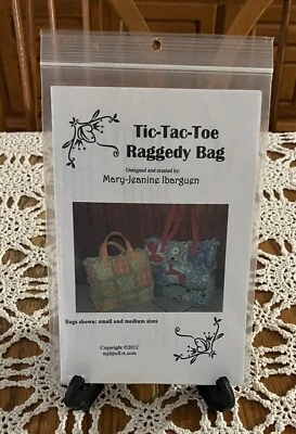 Nuevo 2012 Mary-Jeanine Ibraguen Tic-Tac-Toe Raggedy Bolso Patrón Foto 1 de 3