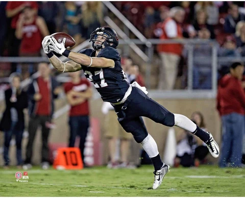 Christian McCaffrey Stanford Cardinals Unsigned Black Jersey Diving Cover