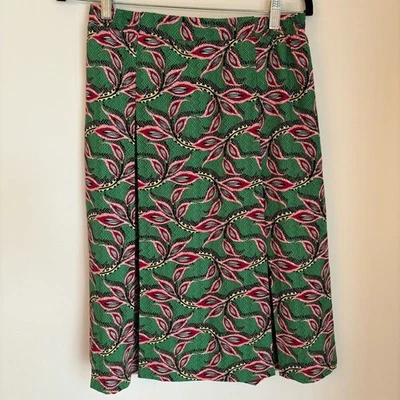 Pleione Mujer Pavo Real Pájaro Pluma Joya Tono Hasta la Rodilla Falda Plisada Grande Foto 1 de 4