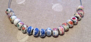 18 PATTERNED WHITE CERAMIC CHARM BEADS, LARGE SILVER CORE HOLE - Picture 1 of 6
