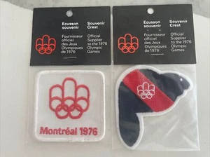LOTE DE 2 RAROS PARCHES OLÍMPICOS DE VERANO MONTREAL 1976 VINTAGE SELLADOS NUEVOS EN PAQUETE - Imagen 1 de 4