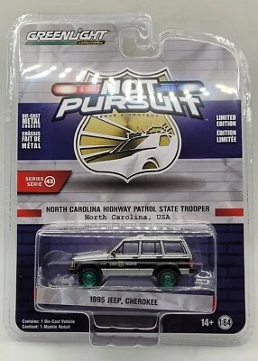 Greenlight Green Machine Hot Pursuit 1995 Jeep Cherokee N.C. State Trooper  - Image 1 of 4
