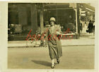 RP - Lady crossing street by CAR SHOWROOM. 'SIT UP AND BEG'  Bike in b.g.- 1920s
