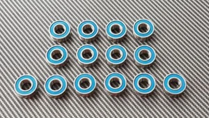 TUNING KUGELLAGERSATZ "DELUXE - GUMMI" FÜR TAMIYA NEO FIGHTER MODELLE - 14 LAGER - Bild 1 von 1