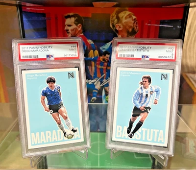LOTE COM 2 CARTAS ARGENTINA 2017 PANINI NOBREZA #92 MARADONA E #94 BATISTUTA PSA 9 - Imagem 1 de 4