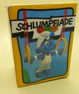 SUPERSCHLÜMPFE - SMURFS aus SCHLÜMPFE --40510 Schlumpf RINGE GYMNAST SMURF MIB - Bild 1 von 1