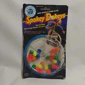 VINTAGE 1984 SPOKEY DOKEYS BMX BIKE SPOKE SPINNING ACTION TOY ON CARD 25 Piece - Picture 1 of 2