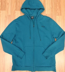 FELPA CON CAPPUCCIO OAKLEY SURF COTONE/POLICOLORE ACQUA Taglia X-LARGE, XL - Foto 1 di 7