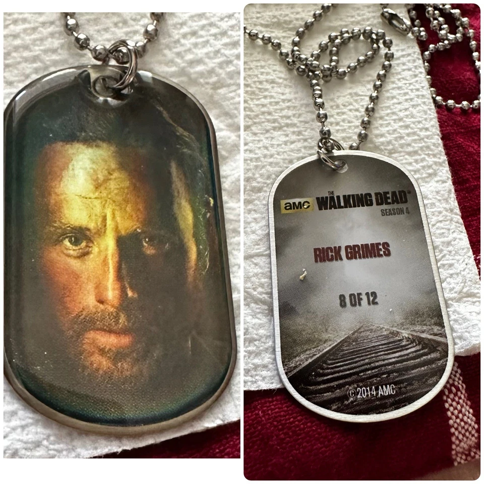 Waking Dead Dog Tags 13 Pieces  Includes   2 Hologram 1 With Piece Of Clothing￼ - Image 1 of 4