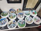 Danbury Mint Complete Set of 12 Peanuts Magical Moments Collector Plates.