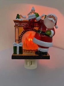Santa Claus Hanging Stockings On The Fireplace Mantle Flickering Night Light - Picture 1 of 7