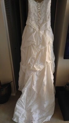 Wedding dress size 8. One Of A Kind By Alec Milano. Worn Once And Dry Cleaned. - Image 1 of 4