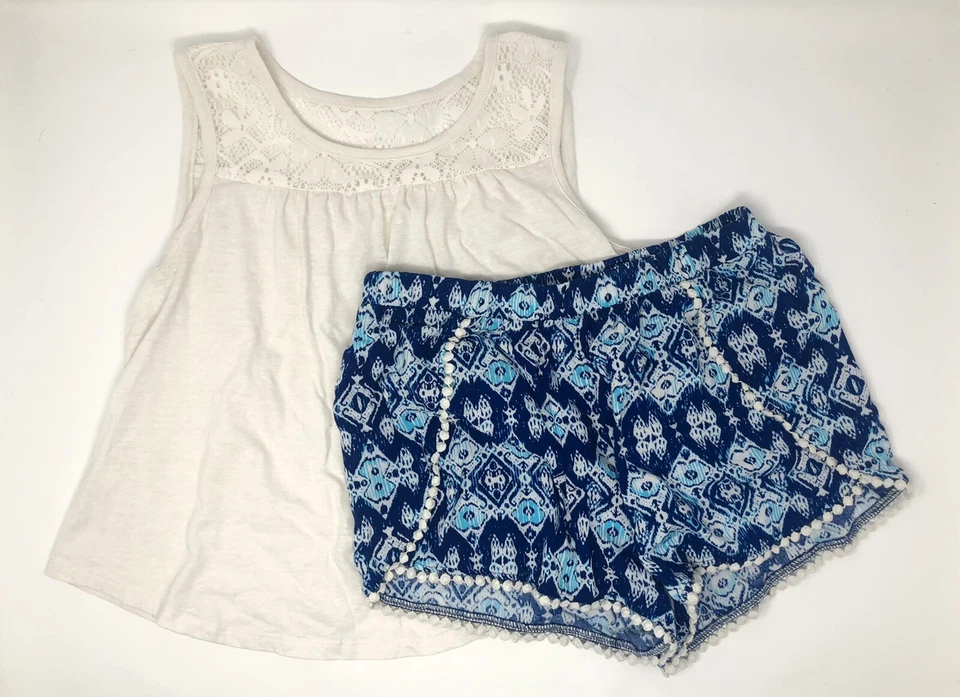 Conjunto de camiseta sin mangas y pantalones cortos de verano azul/blanco roto para niñas talla grande 10/12 Foto 1 de 4