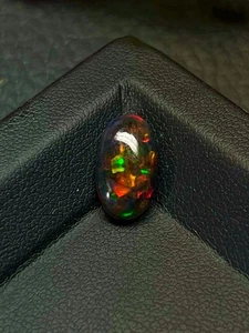 Ethiopian Black Opal Cabochon: Multi-Fire Oval Gemstone (13x7mm ) - Picture 1 of 4