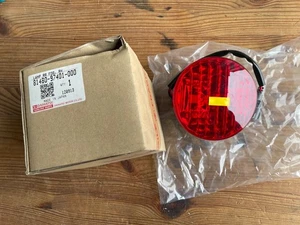 Daihatsu YRV RHD NEW GENUINE RH rear fog lamp 8148097401000 **RARE** 24C3 - Picture 1 of 6