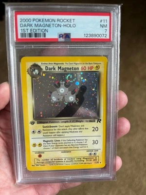 1st Edition Pokemon Team Rocket - Dark Magneton - 11/82 - Holo w/Swirl - PSA 7 - Image 1 of 2