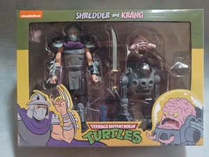 NECA Shredder and Krang TMNT Teenage Mutant Ninja Turtles Cartone Animato Confezione da 2 **NUOVO** - Foto 1 di 7