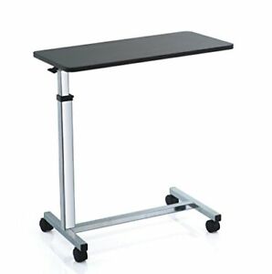 Over bed table with 4 castors and height adjustable top - raises with 1 finger