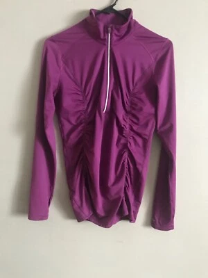 JERSEY MOVING COMFORT MORADO 1/2 CREMALLERA TOP PARA CORRER REFLECTANTE, AGUJEROS PARA LOS PULGARES M Foto 1 de 4