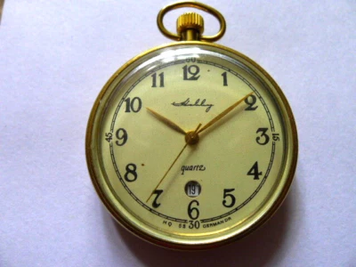 Relógio de bolso Hobby Ruhla 13... folheado a ouro... Janela de data... 45 mm de largura. Funcionando totalmente - Imagem 1 de 4