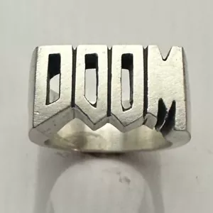 ANELLO DOOM IN ARGENTO STERLING MJG. 23 GRAMMI. BIKER. CHITARRISTA LETTORE - Foto 1 di 7