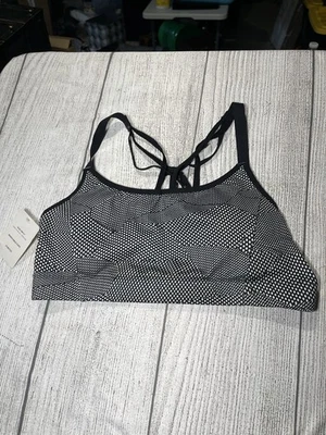 Sujetador deportivo Champion pequeño negro con tiras malla trasera sin alambre no acolchado para mujer Foto 1 de 4