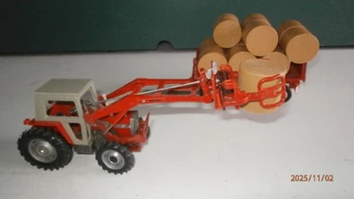 TRACTEUR BRITAINS MF 595 + CHARGEUR + CHARIOT SIKU + BALLES RONDES SIKU - Photo 1/4