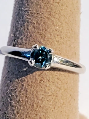 Estate 1970s Platinum 1/4 Carat Round Blue Diamond Engagement Ring - Image 1 of 4