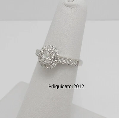 Anillo de compromiso nupcial de oro blanco de 14 K con halo de diamantes ovalados naturales de 1/2 quilate Foto 1 de 4