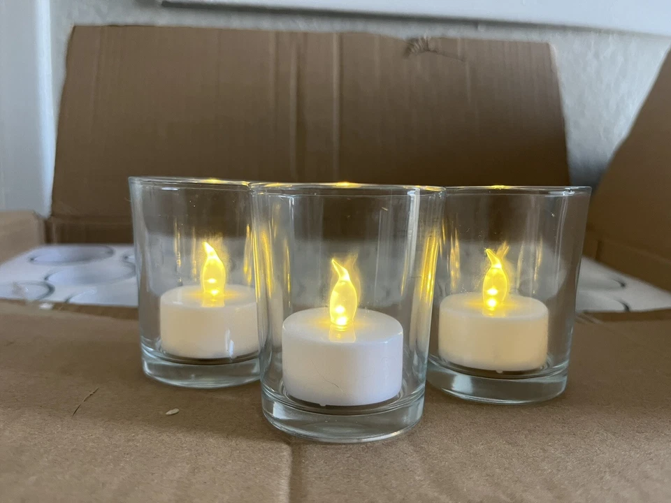 Velas electrónicas de luz de té LED sin llama alimentadas por batería con vidrio Foto 1 de 4