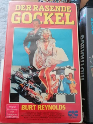 VHS RARITÄT:  BURT REYNOLDS in DER RASENDE GOCKEL (1983) NUR AUF DVD & VIDEO - Bild 1 von 2