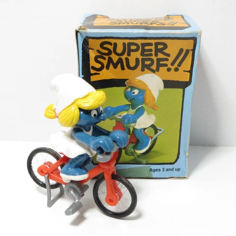 BICYCLE SMURFETTE SUPER SMURF - 40236 - VINTAGE SCHLEICH PEYO 2" PVC FIGURE Cover