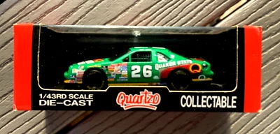 QUARTZO 1/43 NASCAR BRETT BODINE #26 QUAKER STATE RACE CAR IN DISPLAY CASE #2023 - Image 1 of 4