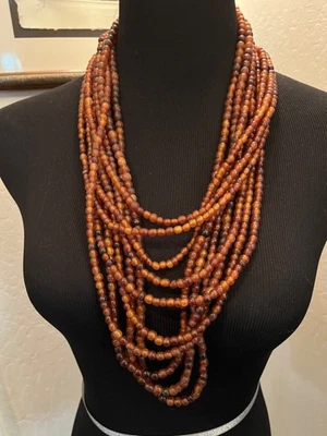 Multilayer warm brown draped necklace possibly acrylic brown clasp - Image 1 of 4