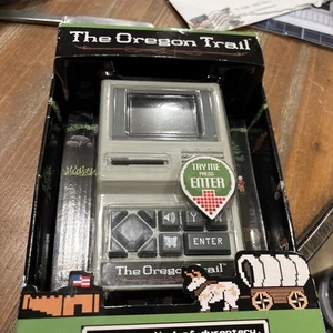 The Oregon Trail Electronic Handheld Retro Classic Computer Video Game - Picture 1 of 8