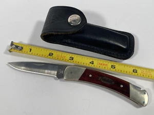 VTG Buck Knife Rosewood Anvil Folding PETERBILT Advertising Knife Leather Sheath - Picture 1 of 6