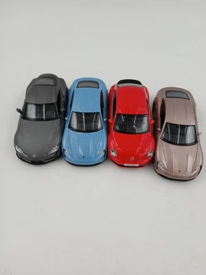 RMZ City Diecast Lot Porsche Taycan VW Beetle Toyota Supra 4 Car Set Models - Image 1 of 4