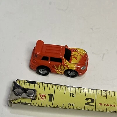 Small Hasbro Micro Machine SUV in Orange with Yellow Flames - Image 1 of 4