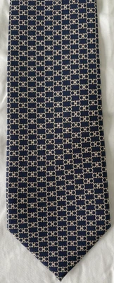 Corbata Salvatore Ferragamo para hombre 100 % seda azul estampado Gancini con dorado Foto 1 de 4