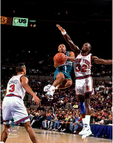 Muggsy Bogues Hornets Unsigned Teal Jersey Mid-Air vs New York Knicks Photo Cover