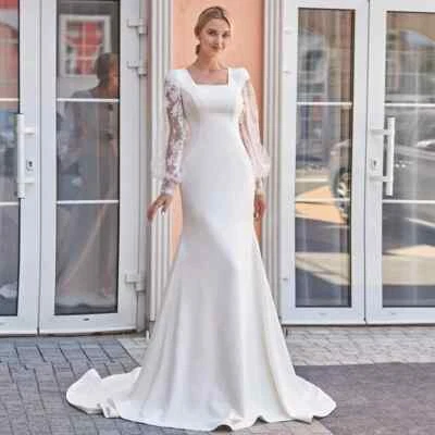 Vestidos de novia clásicos de sirena de satén con botones traseros mangas largas abullonadas con cuello cuadrado Foto 1 de 4