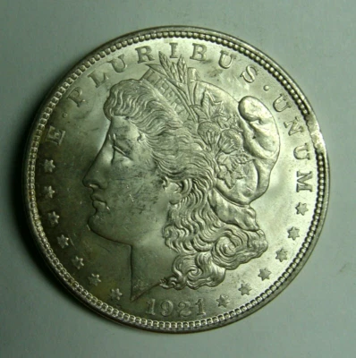 1921 BU MORGAN SILVER DOLLAR WITH SCARCE SMALL PLANCHET CLIP AT 3 O'CLOCK - Image 1 of 4