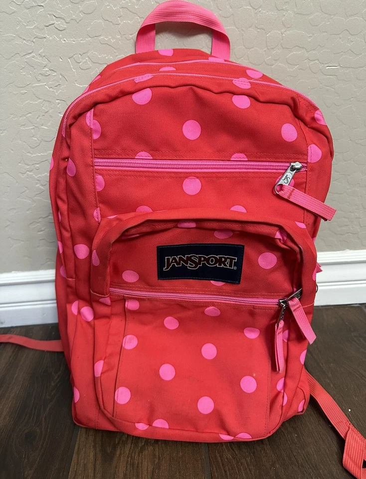 Mochila Jansport roja con puntos rosas usada en excelente estado Foto 1 de 4