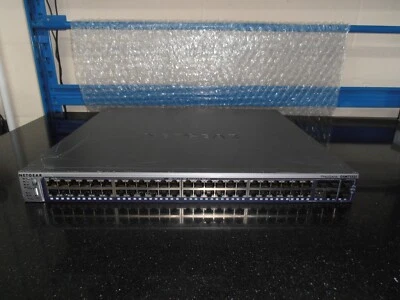 NETGEAR  GSM7352S V2 48 Port  L3 Managed Gig Switch  Fitted 2 X AX742 Stack  Mod - Image 1 of 4