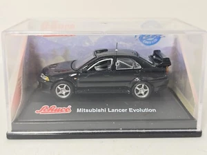SCHUCO 1:72 MITSUBISHI LANCER EVOLUTION BLACK HO / OO MODEL RAIL MODEL CAR - Picture 1 of 2