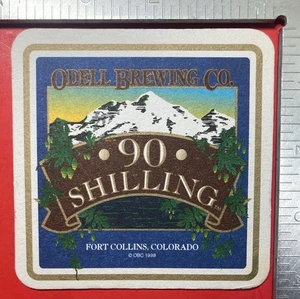 90 SHILLING ODELL FORT COLLINS COLO. MOUNTAINS 4 ZOLL QUADRATISCHER BIERUNTERSETZER - Bild 1 von 2